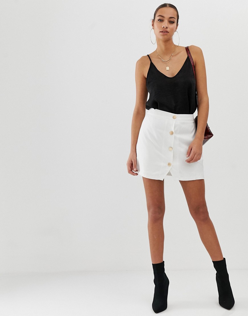 In The Style button detail mini skirt