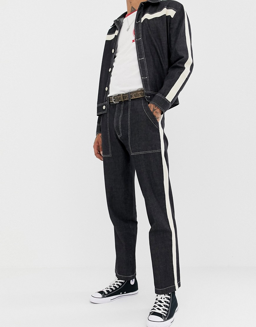 Sacred Hawk tapered jeans with side stripe