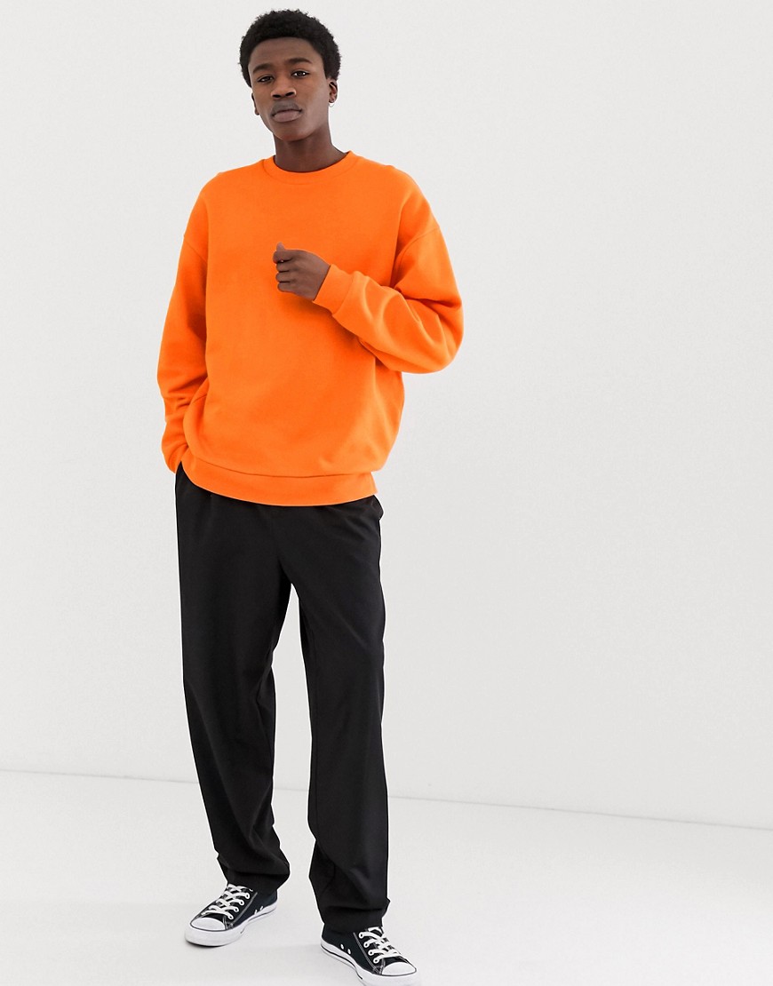ASOS DESIGN oversized sweatshirt in bright orange