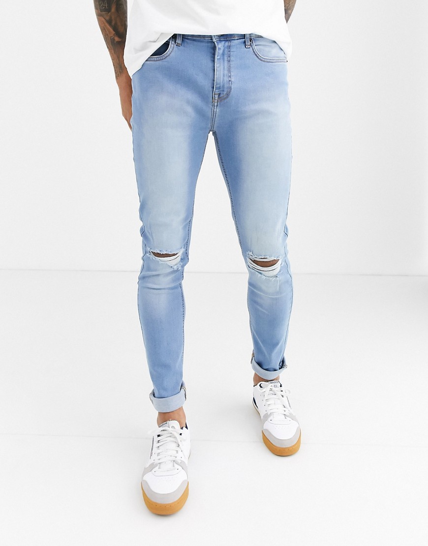Another Influence skinny NOA jeans in blue with knee rip