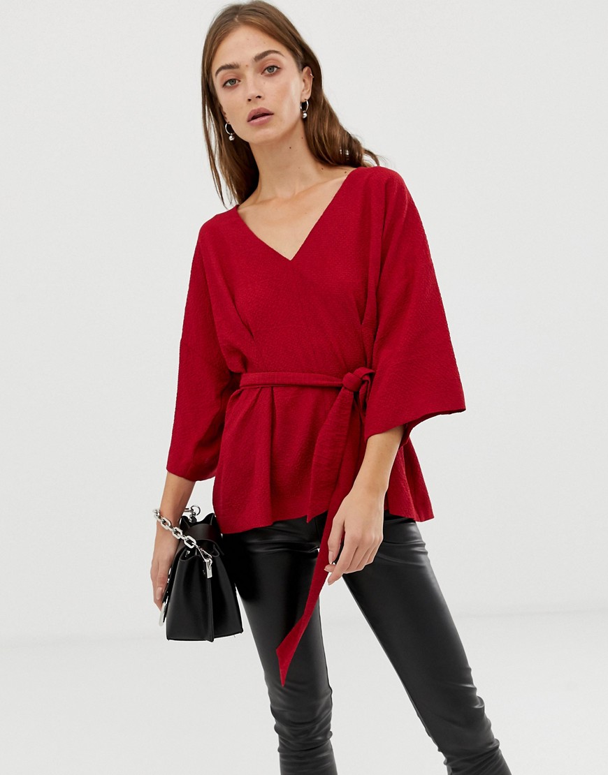 ASOS DESIGN textured oversized top with v neck and tie waist