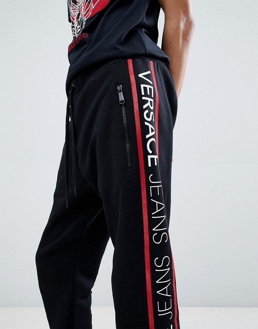 Versace Jeans skinny joggers in black with side taping