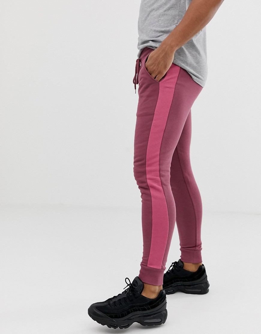 ASOS DESIGN skinny joggers with side stripe in purple