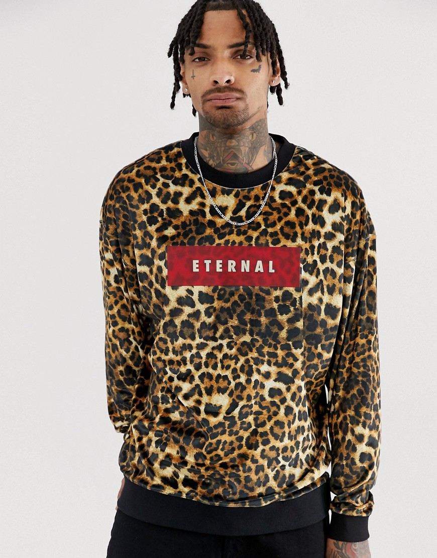 ASOS DESIGN oversized velour sweatshirt in leopard print with slogan text print