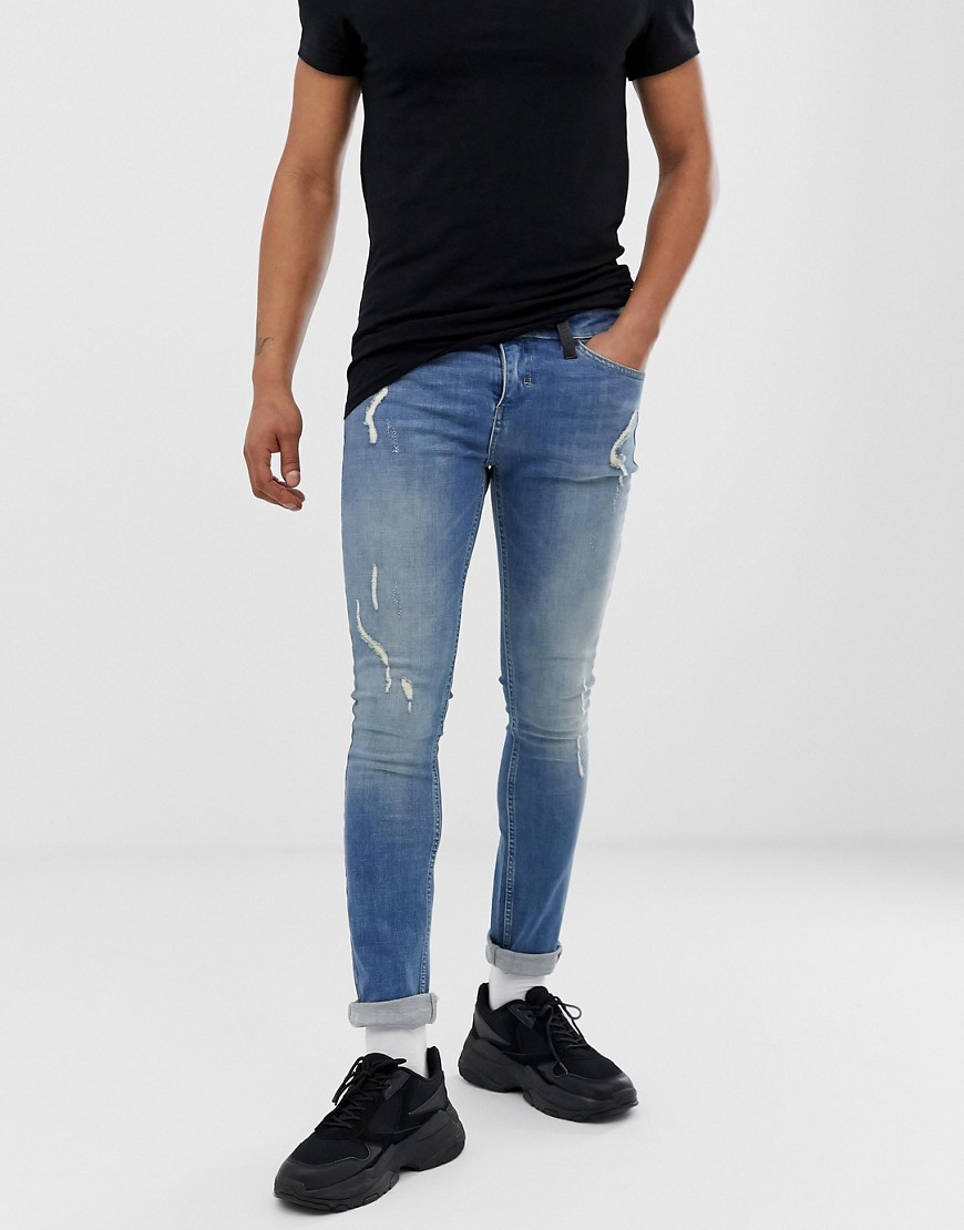 Religion skinny fit jeans with abrasions in blue wash