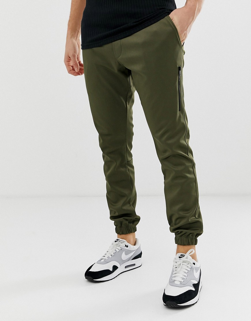 Religion tapered fit joggers in khaki with cuff hem