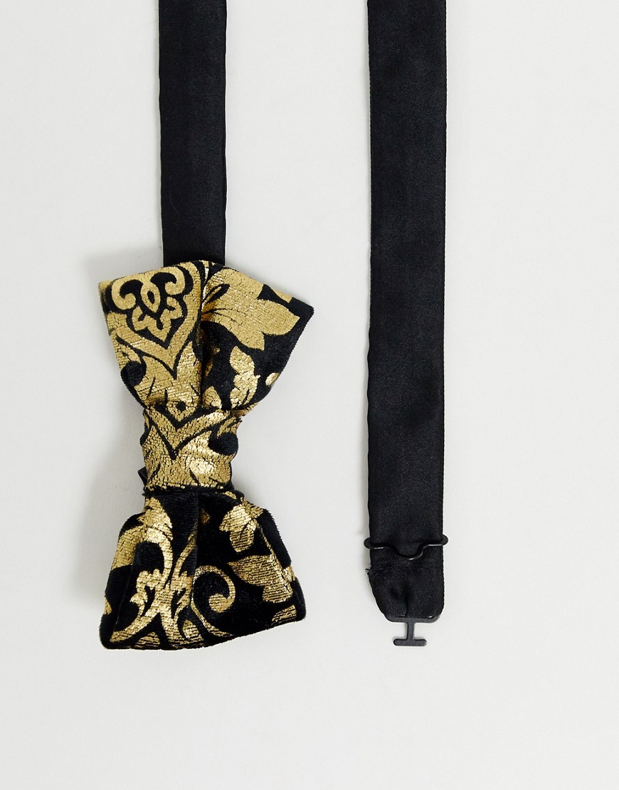 Twisted Tailor bow tie with metallic gold paisley in black