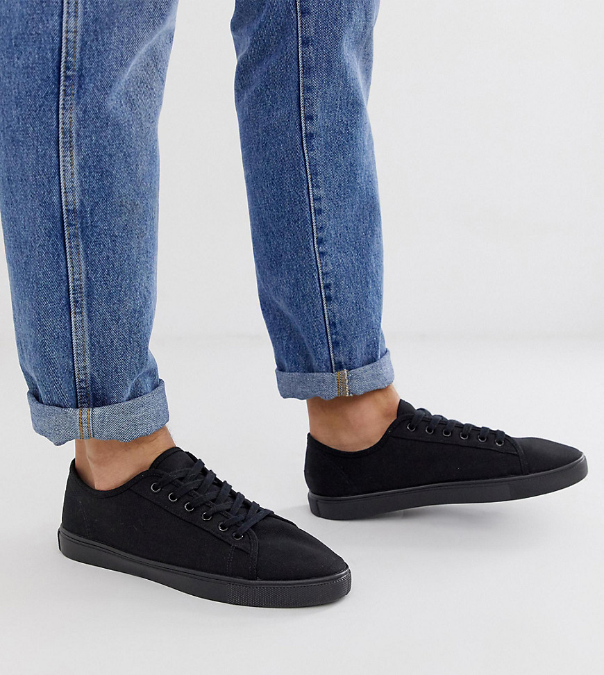 ASOS DESIGN Wide Fit trainers in black canvas