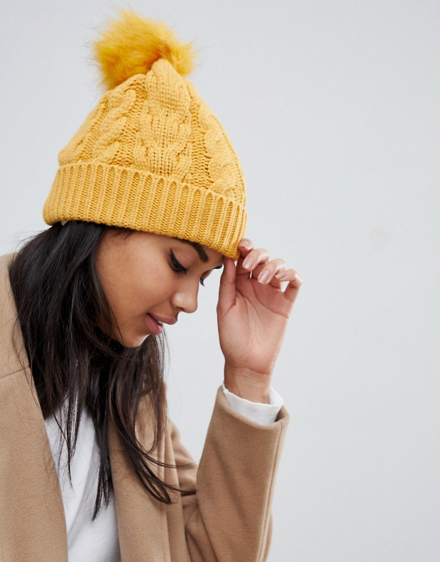 Oasis cable knit beanie with fur pom pom in yellow - Orchre