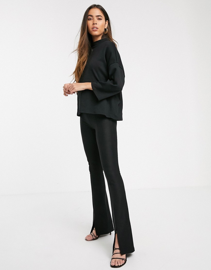 Stradivarius ribbed jersey flare trousers with slit in black
