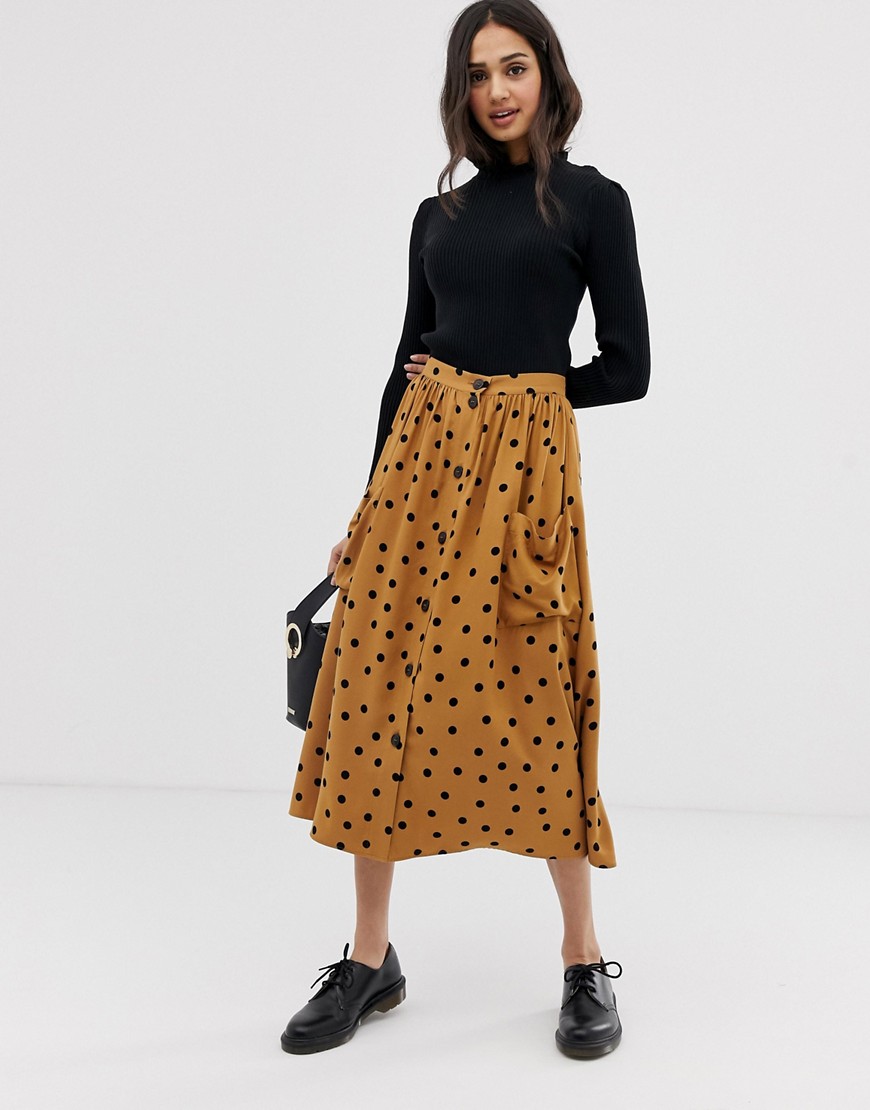 ASOS DESIGN button front midi skirt in polka dot with oversized pockets