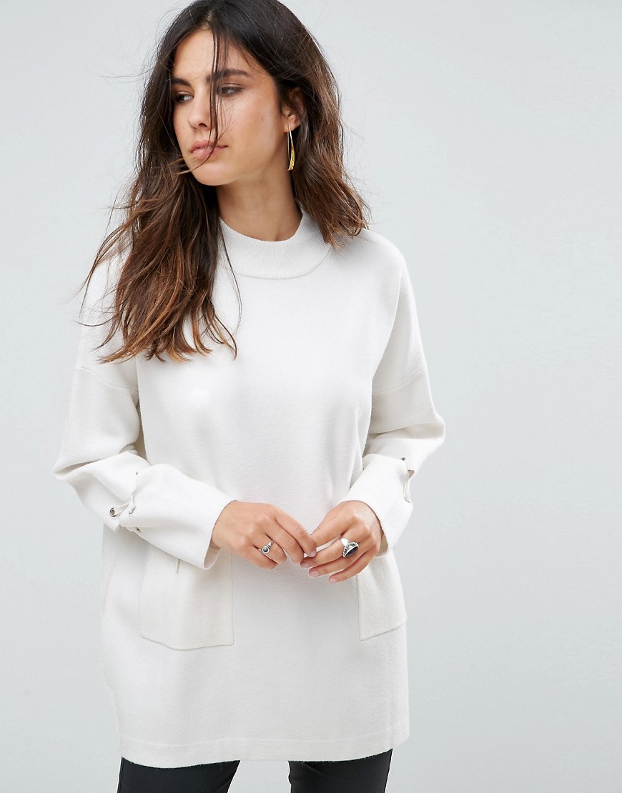 Liquorish Long Turtleneck Jumper With Front Pockets And Lacing Detail On Sleeves - Cream