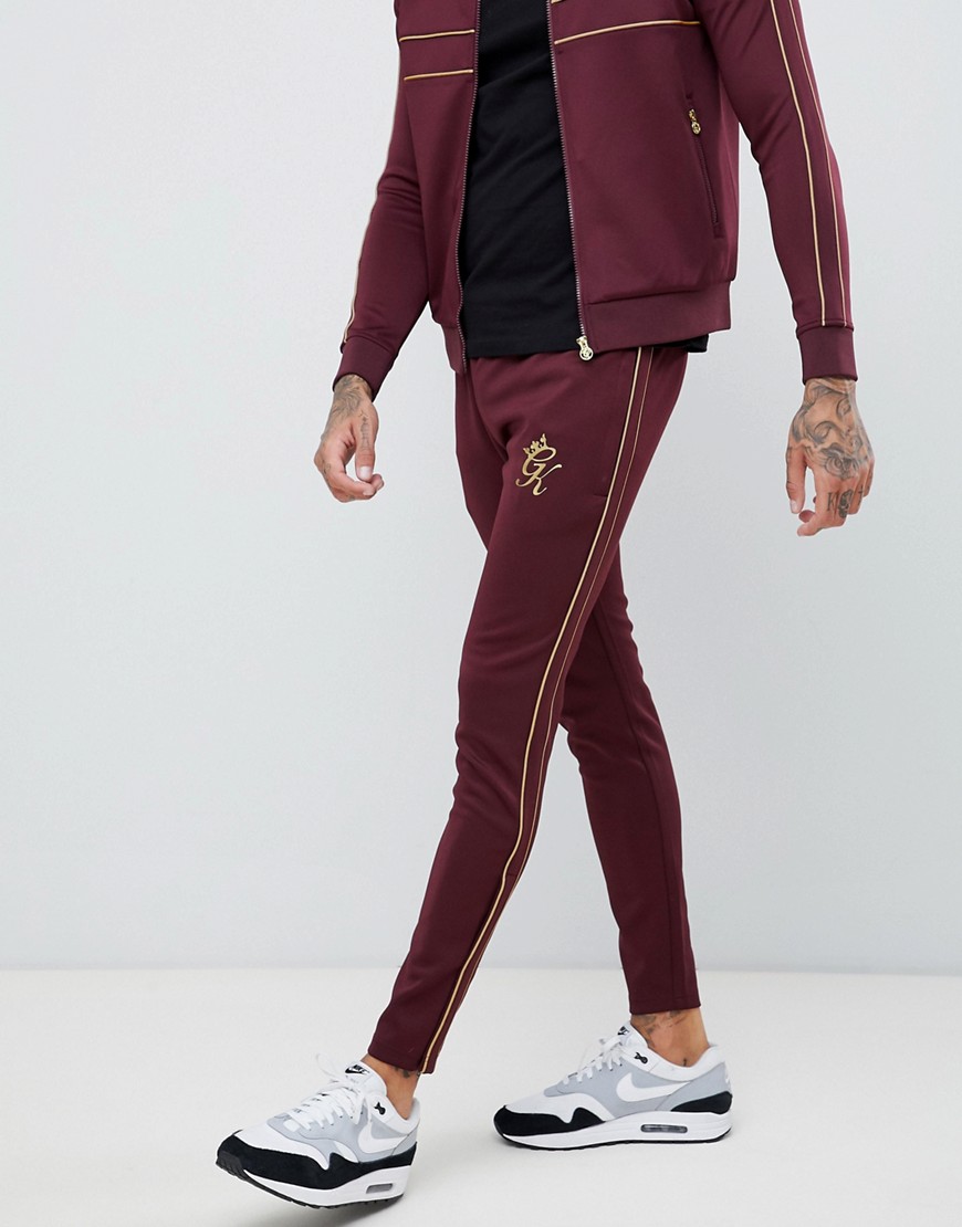 Gym King skinny joggers in burgundy with gold side stripes