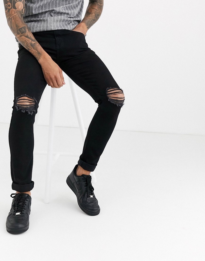 Another Influence skinny NOA jeans in black with knee rips