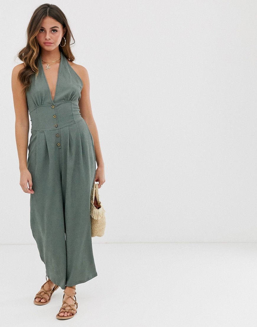 ASOS DESIGN textured halter jumpsuit with button front