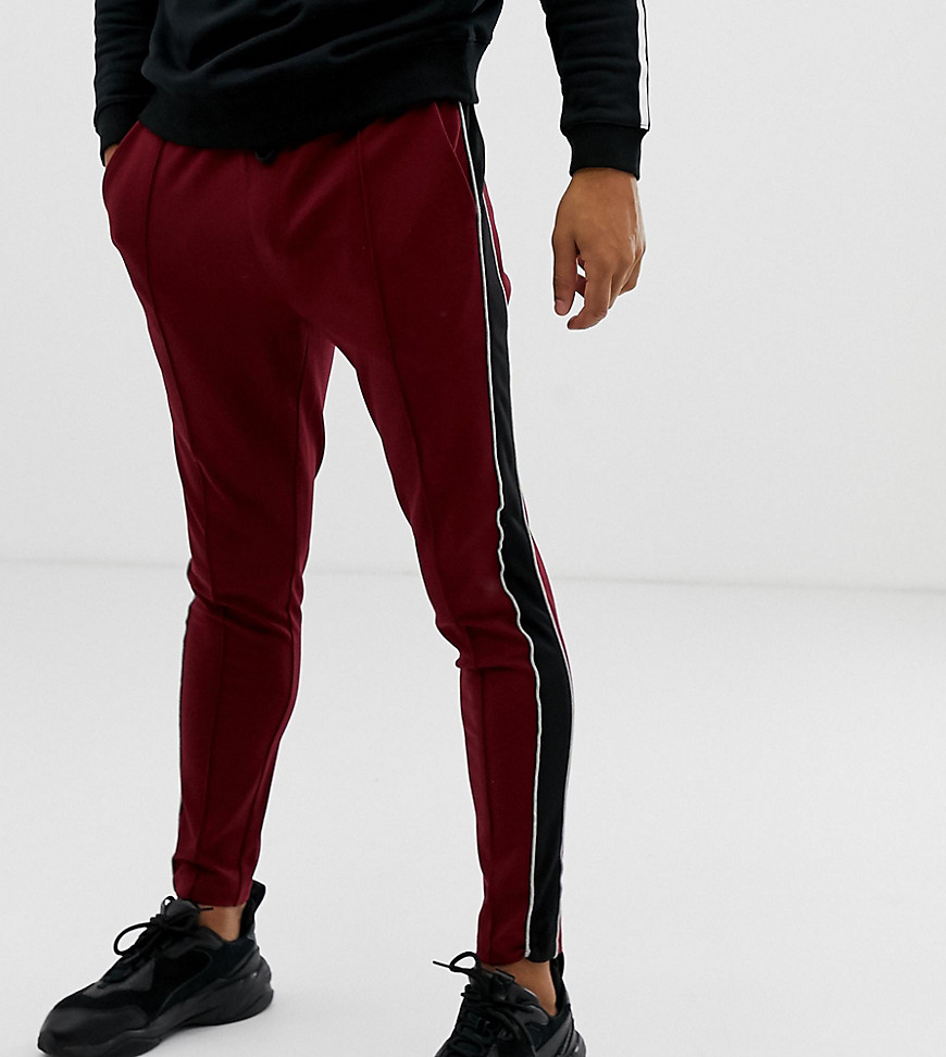 Mauvais muscle jogger in burgundy with side stripe