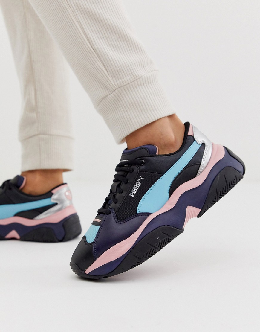 Puma Storm.Y metallic trainers in black and pink