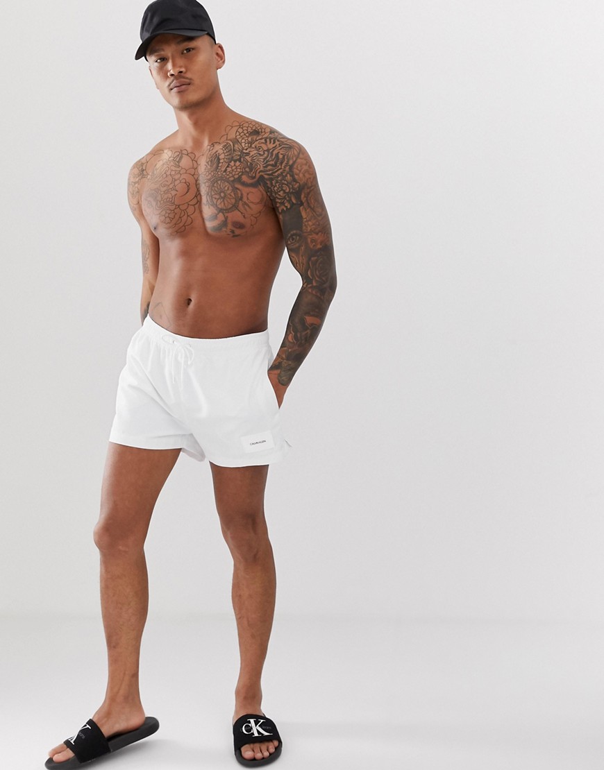 Calvin Klein patch logo swim shorts in white