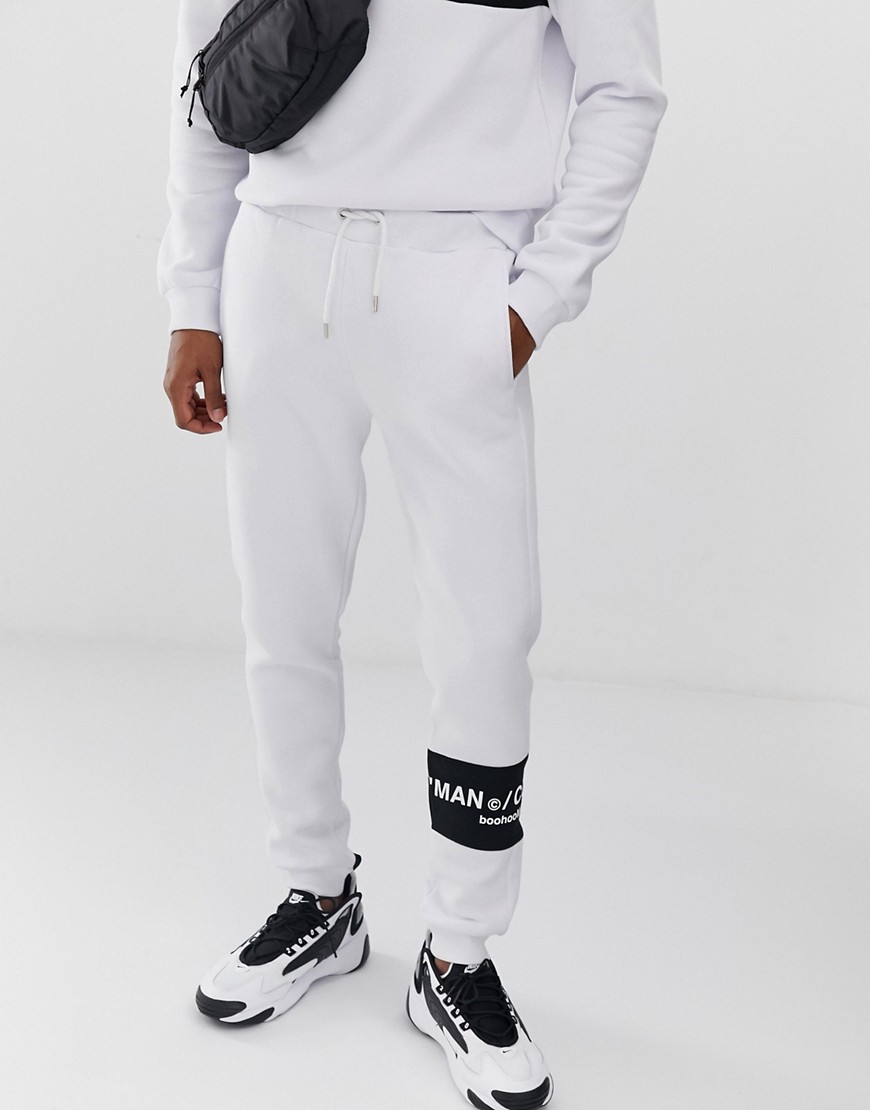 boohooMAN joggers with contrast panel in white