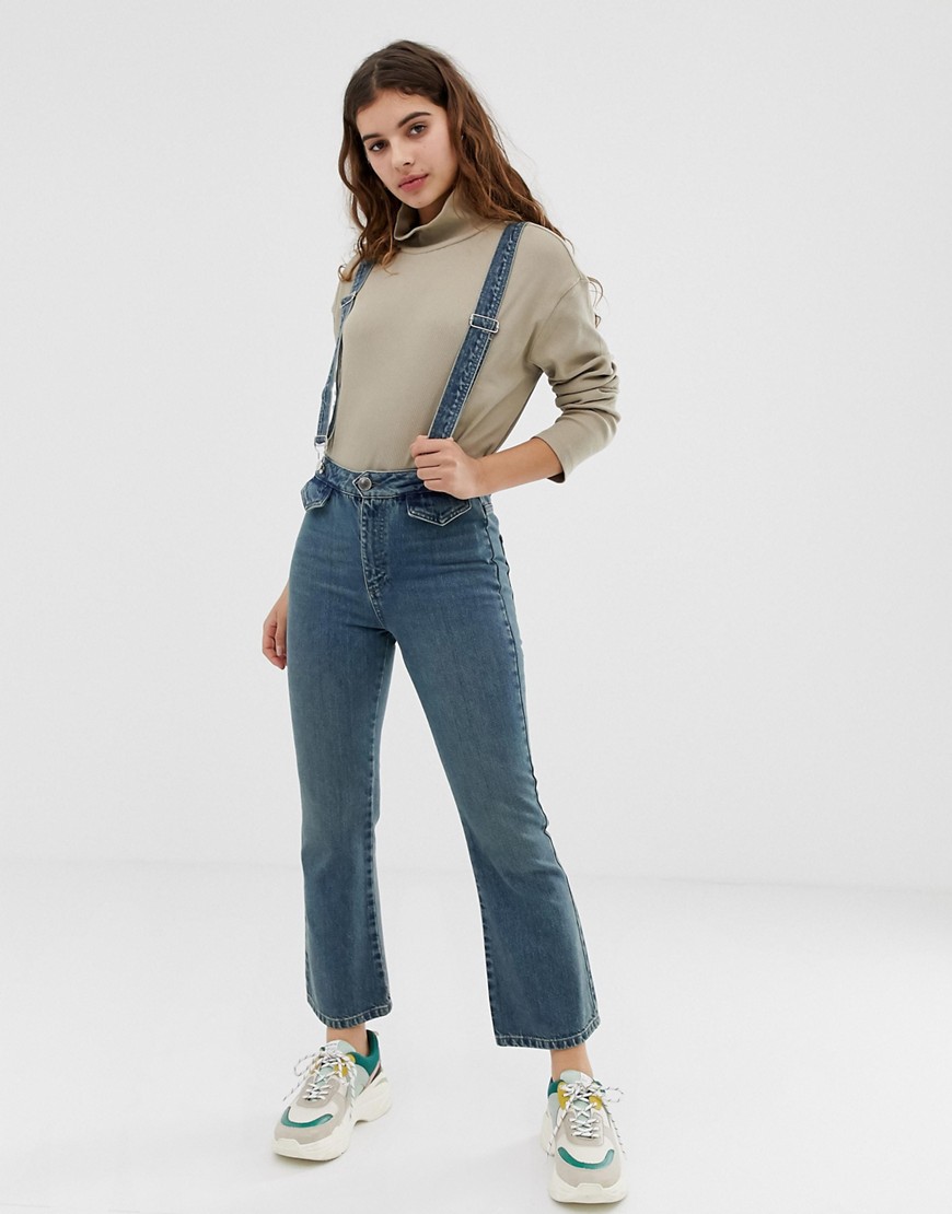 Asos Design Egerton Rigid Cropped Kick Flare Jeans In Aged Mid Wash Blue With Front Pocket Detail And Suspenders
