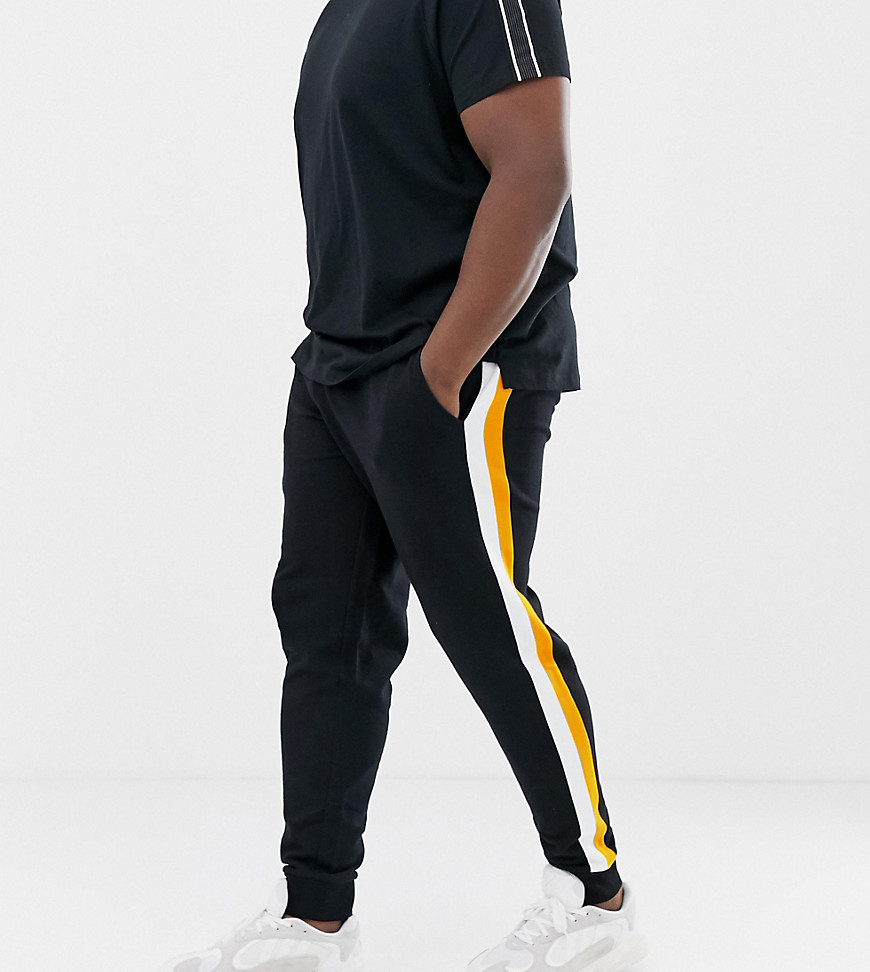 ASOS DESIGN plus skinny joggers with side stripes in black