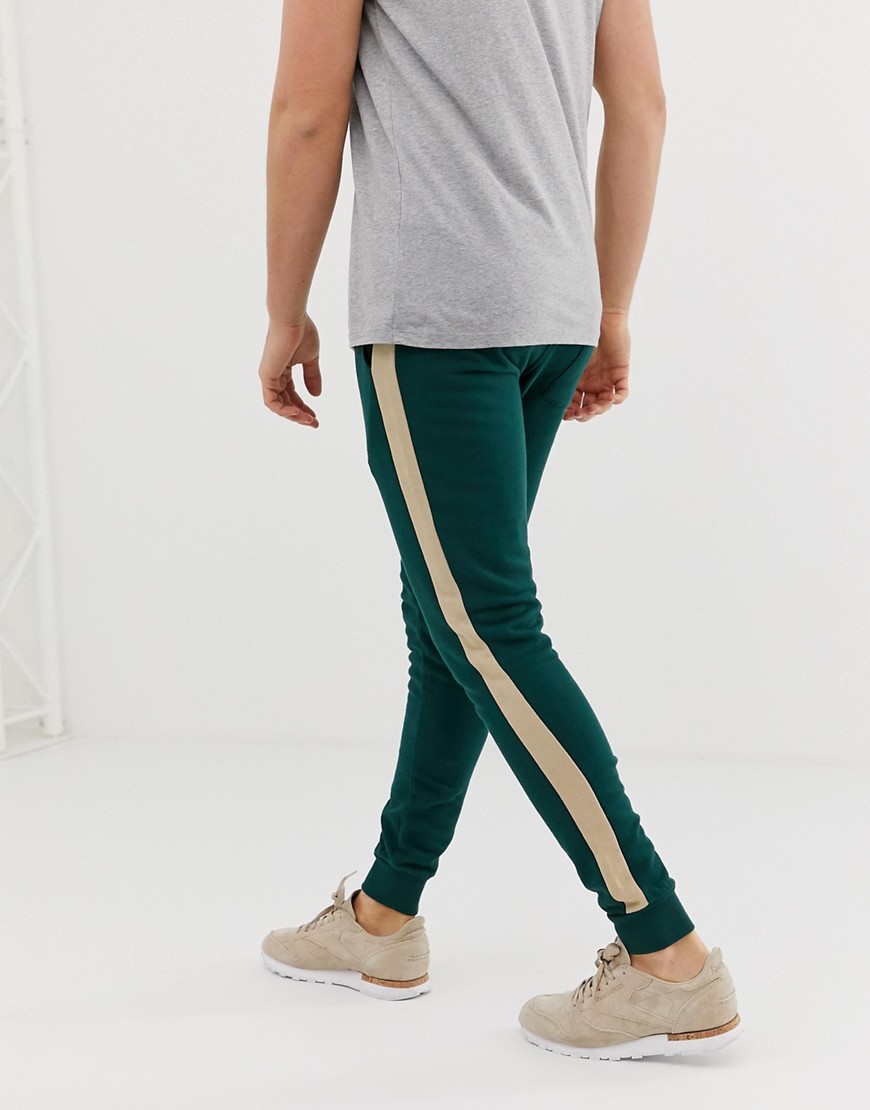 ASOS DESIGN super skinny joggers with side stripe in dark green