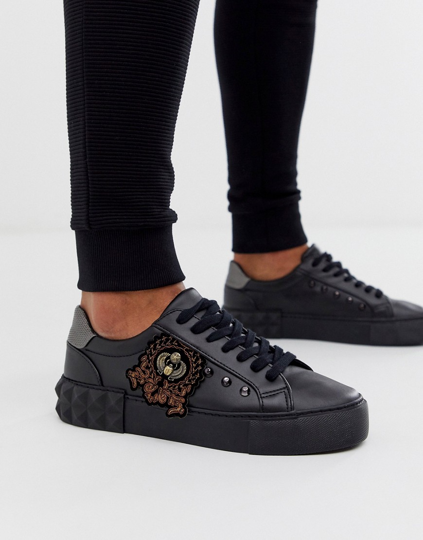 ASOS DESIGN trainers in black with studs and embroidery