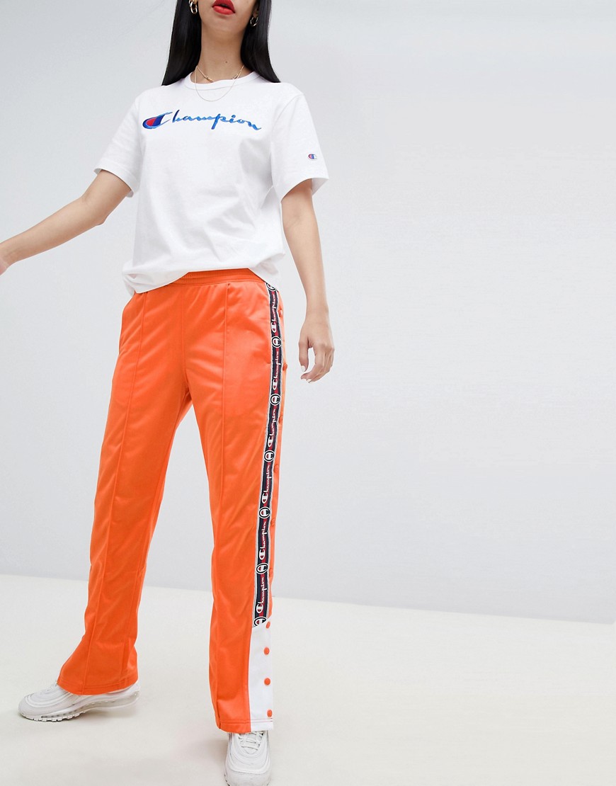 CHAMPION POPPER TRACKSUIT BOTTOMS WITH LOGO TAPING - ORANGE,211855