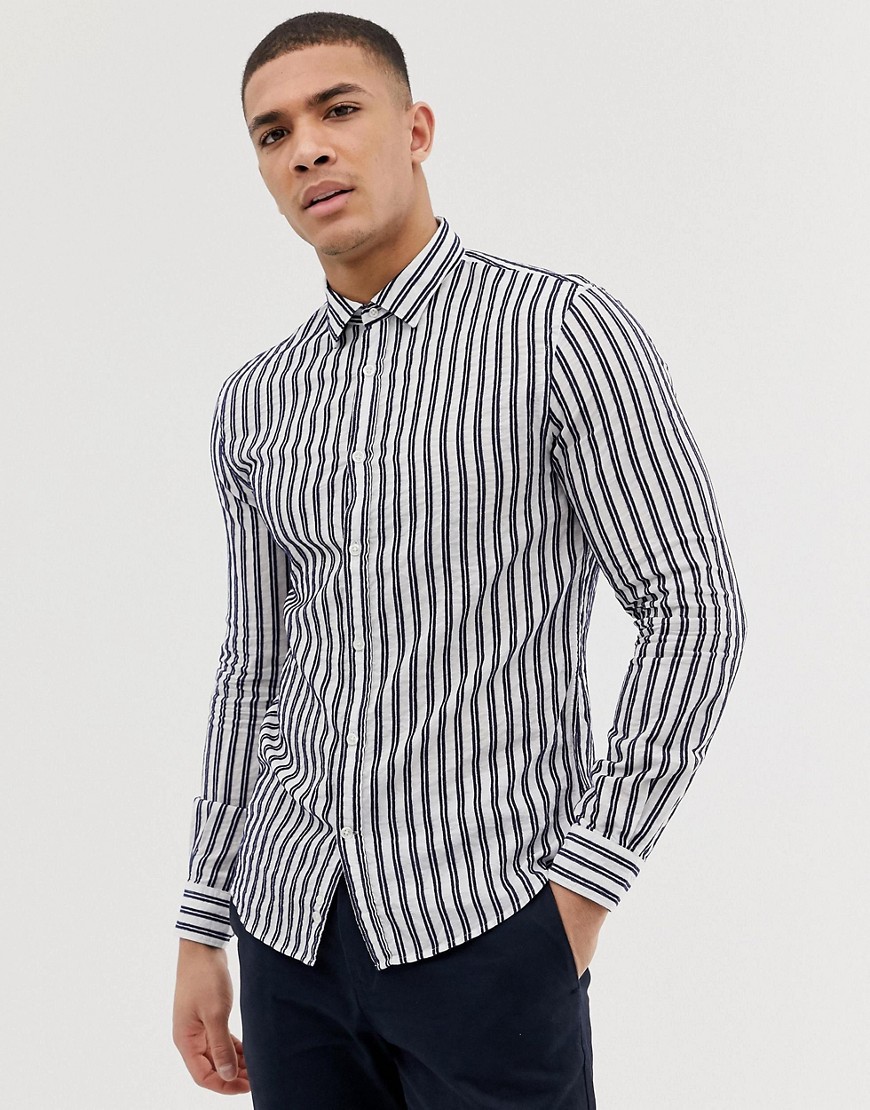 Celio slim fit long sleeve shirt with navy vertical stripe in white