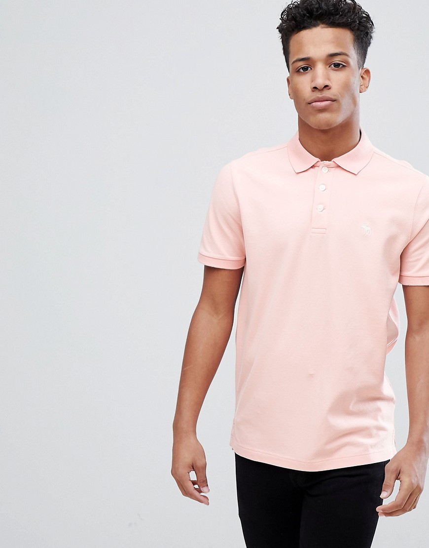 Abercrombie & Fitch Stretch Core Moose Icon Logo Slim Fit Polo in Coral - Coral