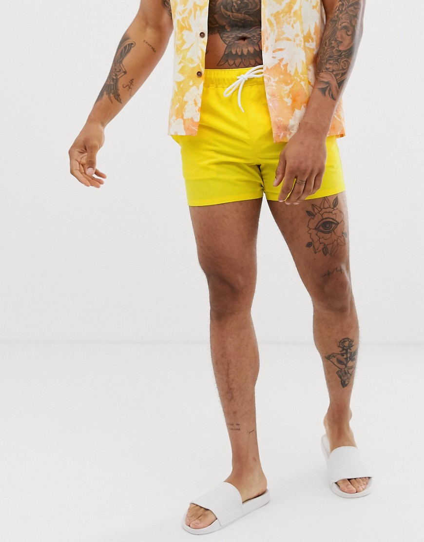 ASOS DESIGN swim shorts in bright yellow short length
