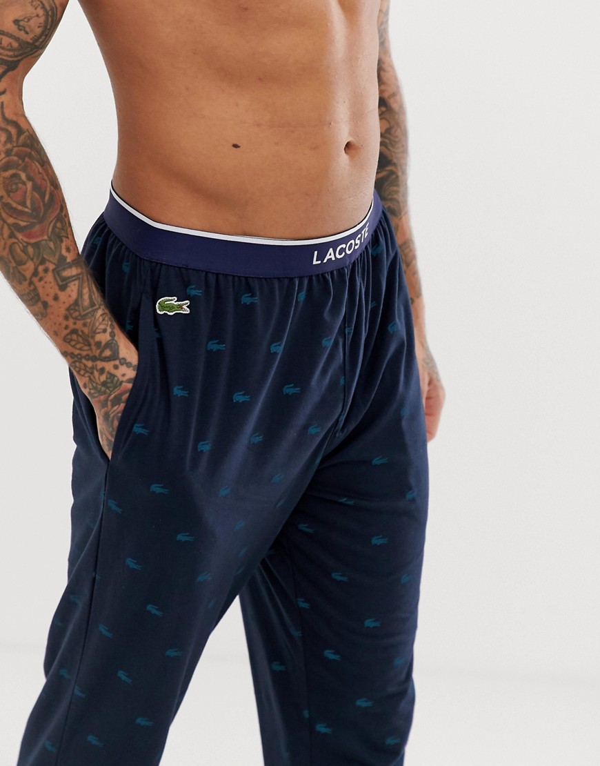 Lacoste logo print cuffed joggers in navy