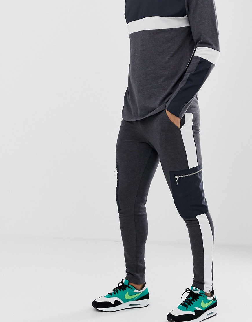 ASOS DESIGN co-ord skinny joggers with side stripe and woven cargo pocket in charcoal
