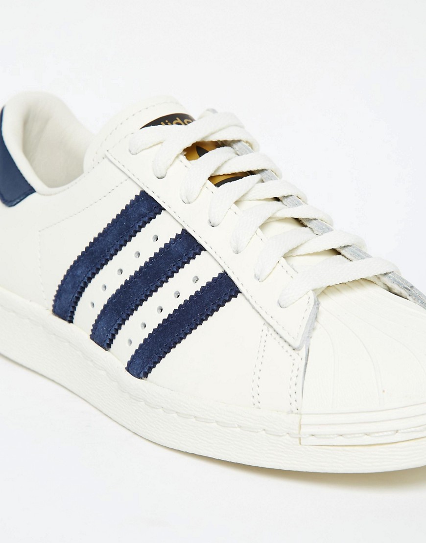 Adidas | adidas Superstar 80s Vintage White & Navy Trainers at ASOS