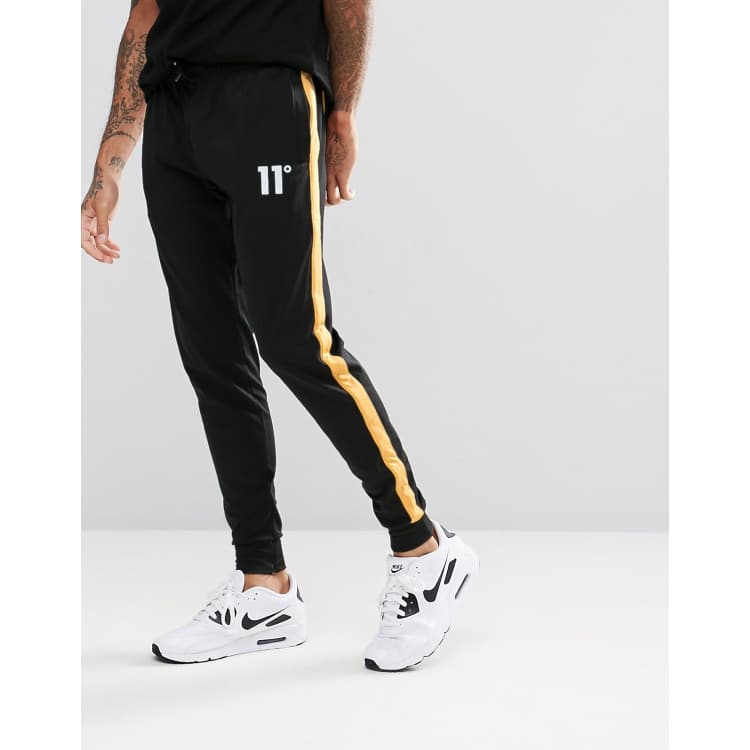 Yellow joggers with deals black stripe