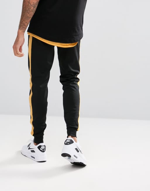 Black sweatpants cheap with yellow stripe