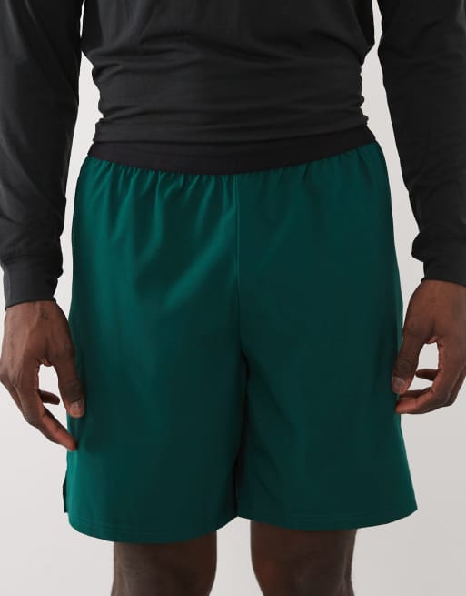 4505 7"" woven training shorts with elastic waist band and zip pockets in bottle green, 4 of 5