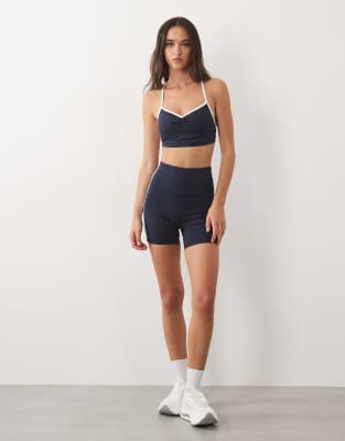 4505 active ruched front sports bra with contrast piping in deep navy