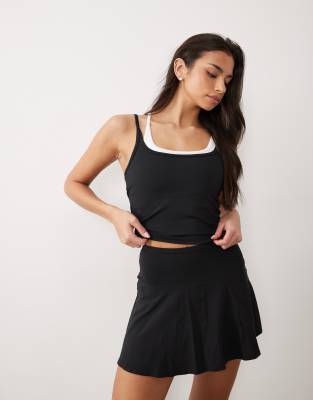 4505 active tennis double layer tank with cross strap back in black and white