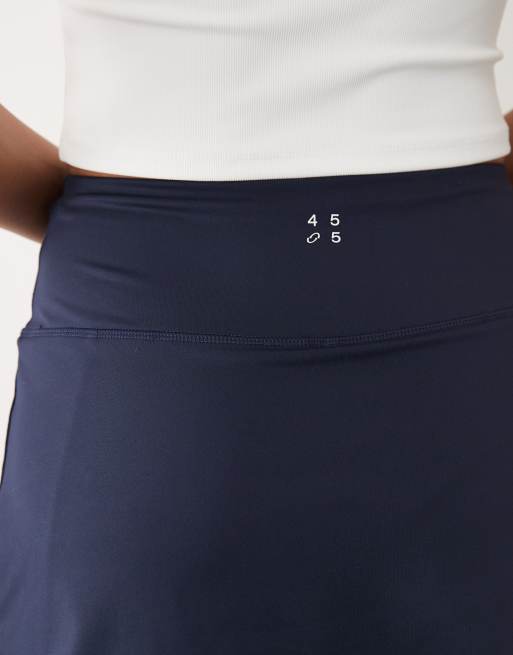 4505 active tennis skirt with under shorts and phone pocket in deep navy, 3 of 5