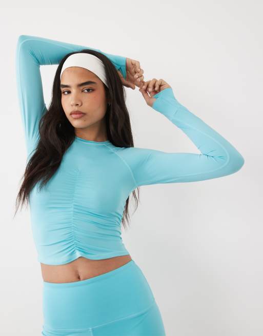 4505 - Active - Top da corsa leggero a maniche lunghe color acqua arricciato sul davanti
