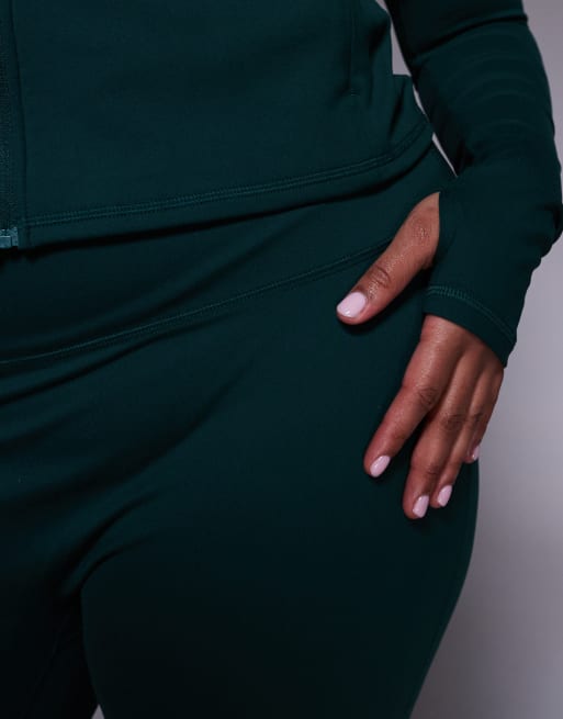 4505 Curve – Icon – Mörkgröna, mjuka yogaleggings med smal passform, hög midja och utsvängd design, 3 av 5