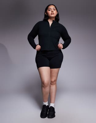 4505 Curve Icon Soft Touch Zip Up Performance Long Sleeve Top In Black