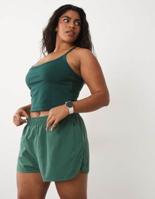 4505 Curve Icon Woven Running Shorts With Zip Pockets In Green