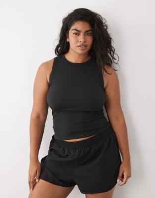 4505 Curve Seamless Lightweight Rib 90s Racer Tank Top In Black