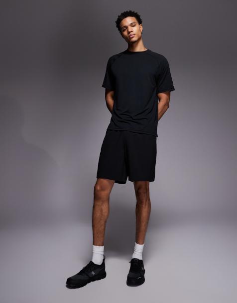 4505 - Geweven trainingsshort van 18cm met elastische taille en ritszakken in zwart - view 1