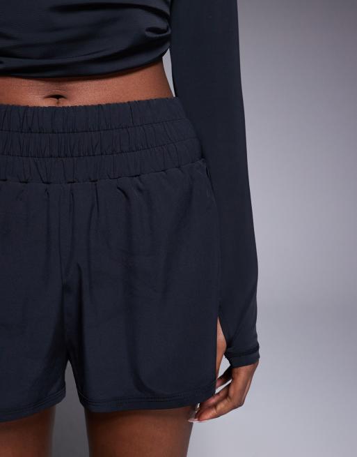4505 high waist woven running shorts with zip phone pocket in black, 5 of 5