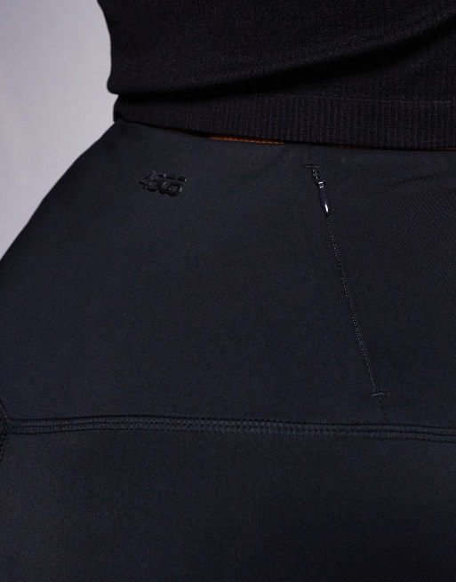 4505 Hourglass Icon active high waist 5 inch legging short with zip phone pocket in black, 3 of 5