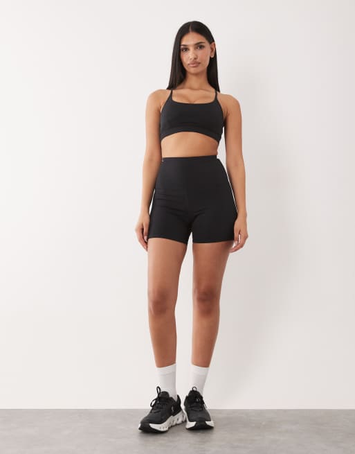 4505 Hourglass Icon active high waist 5 inch legging short with zip phone pocket in black, 2 of 5