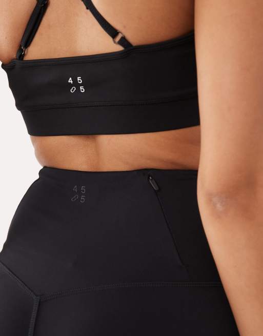 4505 Hourglass Icon active high waist 5 inch legging short with zip phone pocket in black, 3 of 5